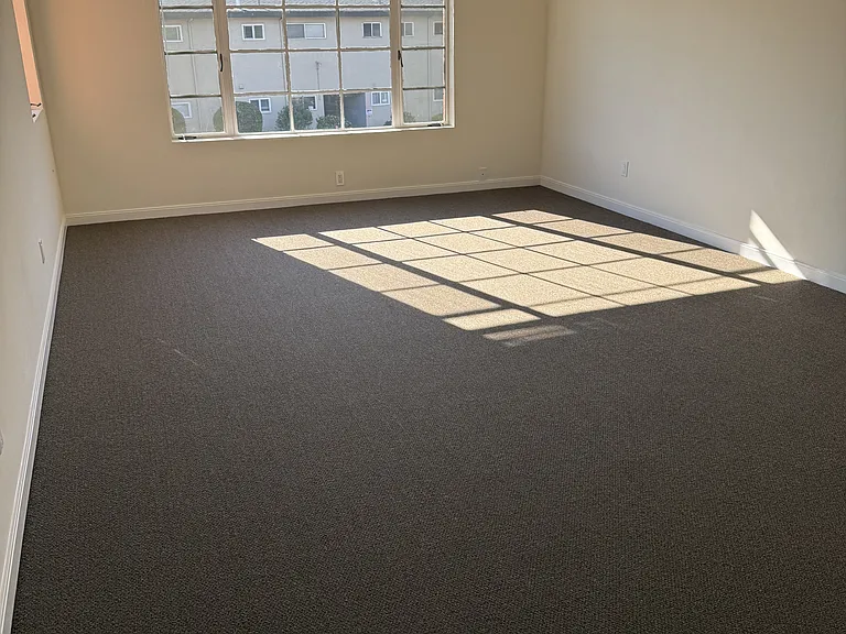 Living room with two windows for natural lighting