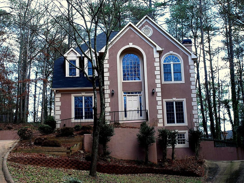 A graceful winding drive leads to this home at the end of the street.