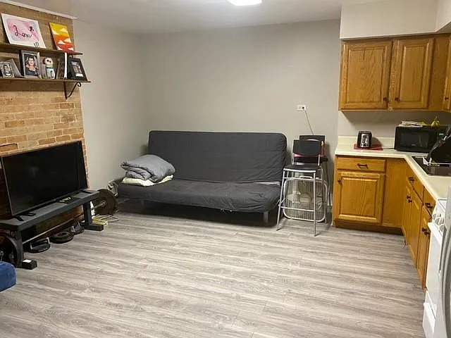 Fresh Paint and Exposed Brick Living/Kitchen.