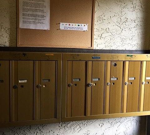 Keyed mailbox located in entryway of building