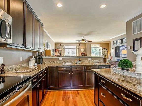 Spacious kitchen with stainless steel appliances and recently added recess lighting