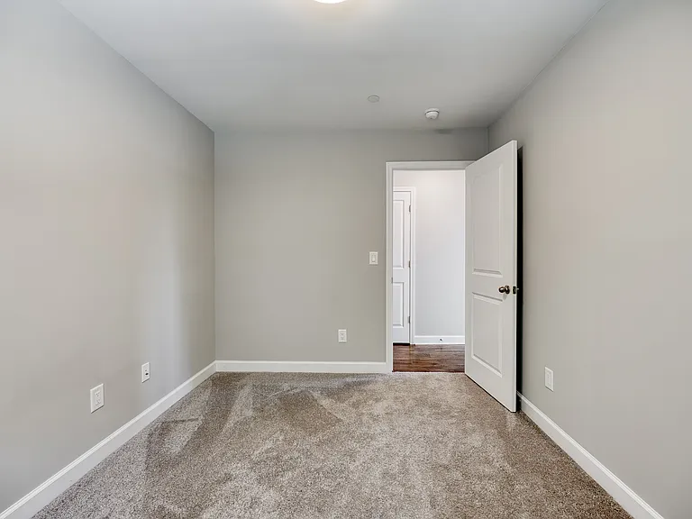 Cozy third bedroom, ideal for a home office or guest room.