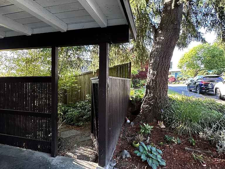 Private tenant entrance with pathway leading to the front door.