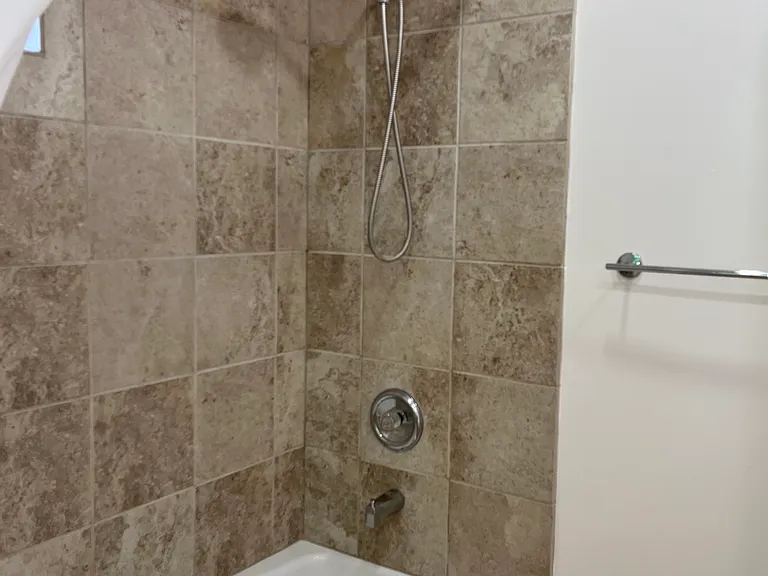 BATHROOM SHOWER W/ NEW TILE