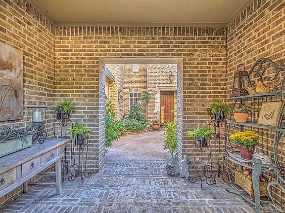 Through this covered entrance is the courtyard with covered patio/fireplace, Casita to the left and front door straight ahead.