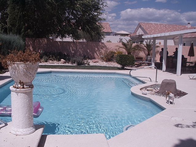 covered patio, pool, cool deck and hot tub