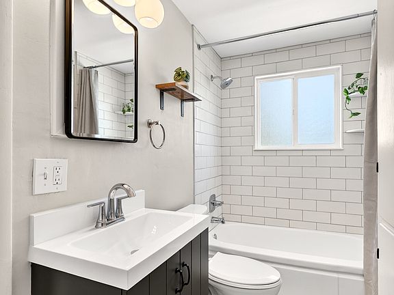 Brand new modern bathroom with lots of extra cabinet storage.