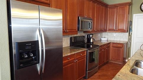 Stainless steel appliances and beautiful 42" cherry cabinets
