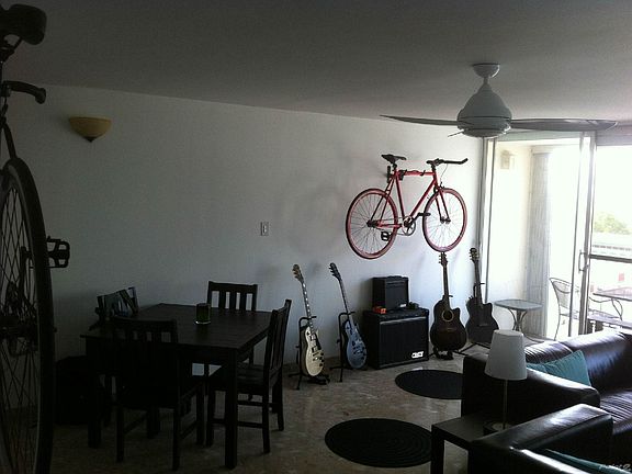 Spacious Living Room with North-facing balcony and lots of natural sunlight and cool breeze.