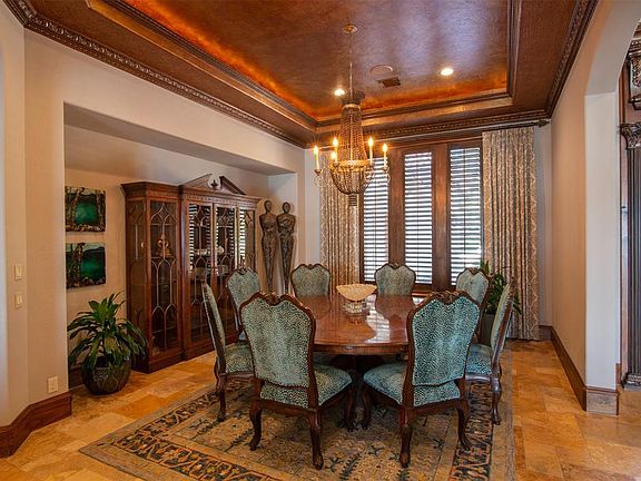 To the right of the entry is the formal dining room with its dramatic ceiling detail. What a beautiful spot for a lovely formal dinner with friends.