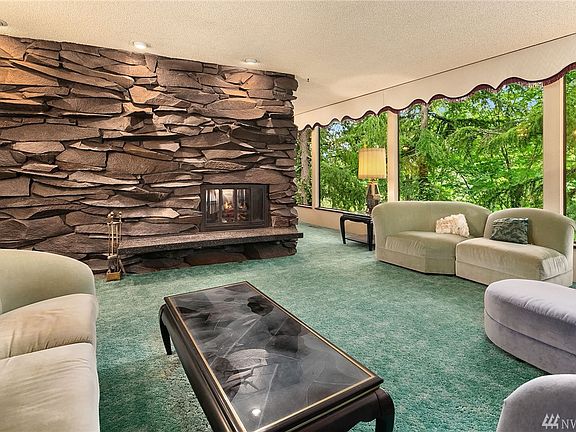 Front view of double sided rock fireplace in Main living room