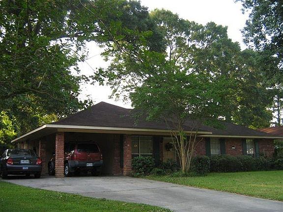 Another view of the front and car port.