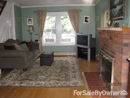 Living Room. : With Brick, Wood Burning Fire Place.