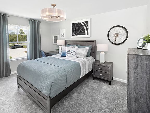 Plenty of space to relax in the new home Aspire guest bedroom.