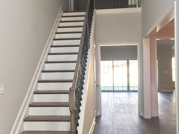 Upstairs to a bed room, full bath and living room