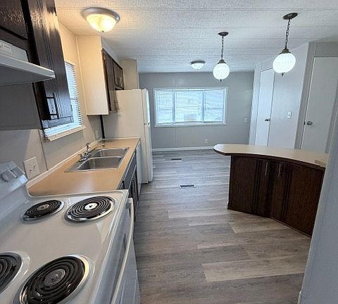 Kitchen with bar & dining area