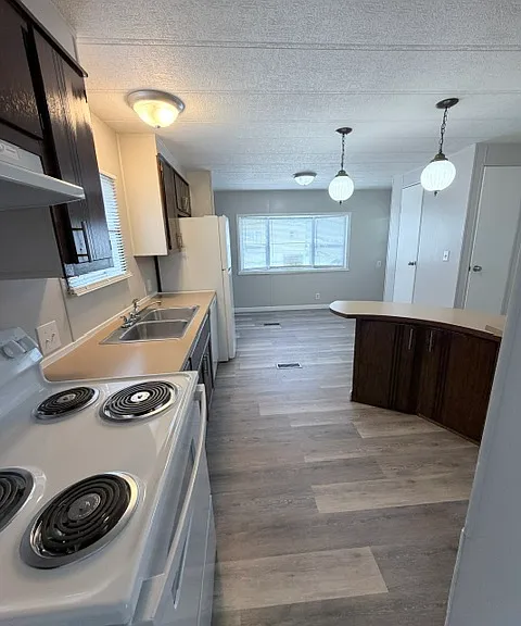 Kitchen with bar & dining area