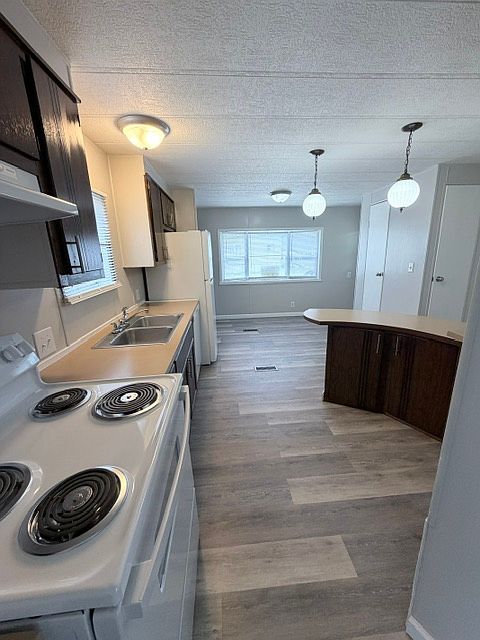 Kitchen with bar & dining area