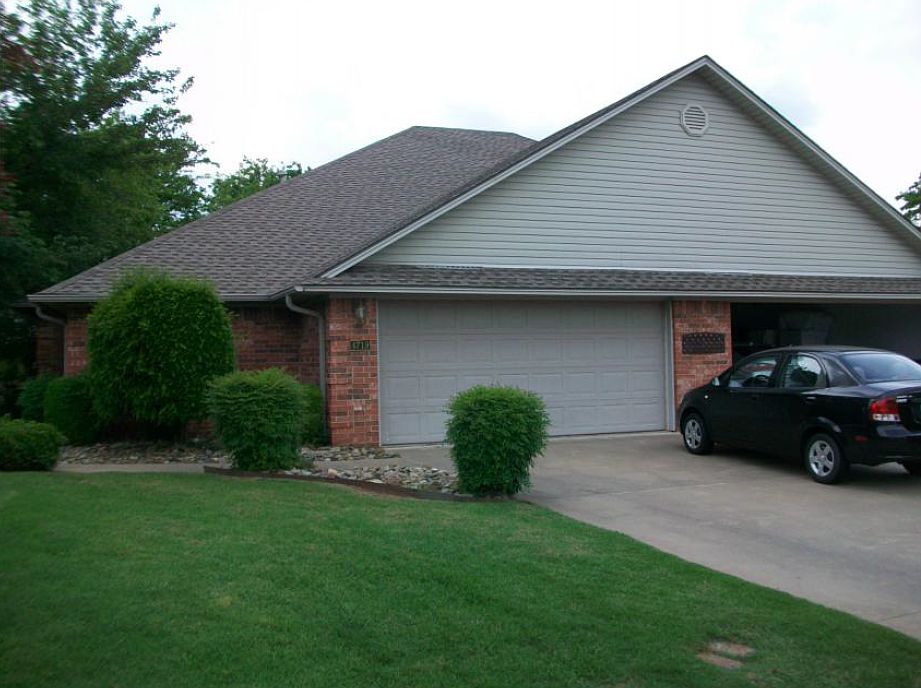 Front yard with 2 car garage and driveway