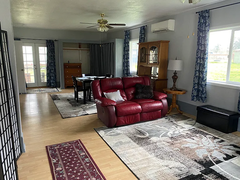 Living room, dining area and closets