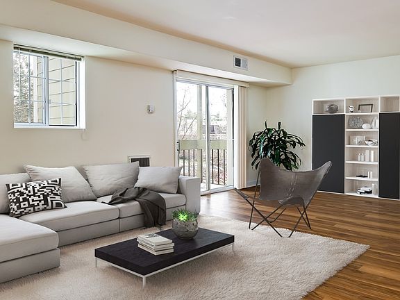 Spacious living room with vinyl wood flooring