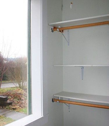 Master closets has built-in shelving for maximum storage.