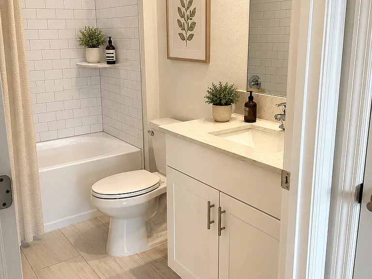 Stylish Downstairs Full Bath
Modern full bathroom with crisp finishes, subway tile shower, and clean designer touches.