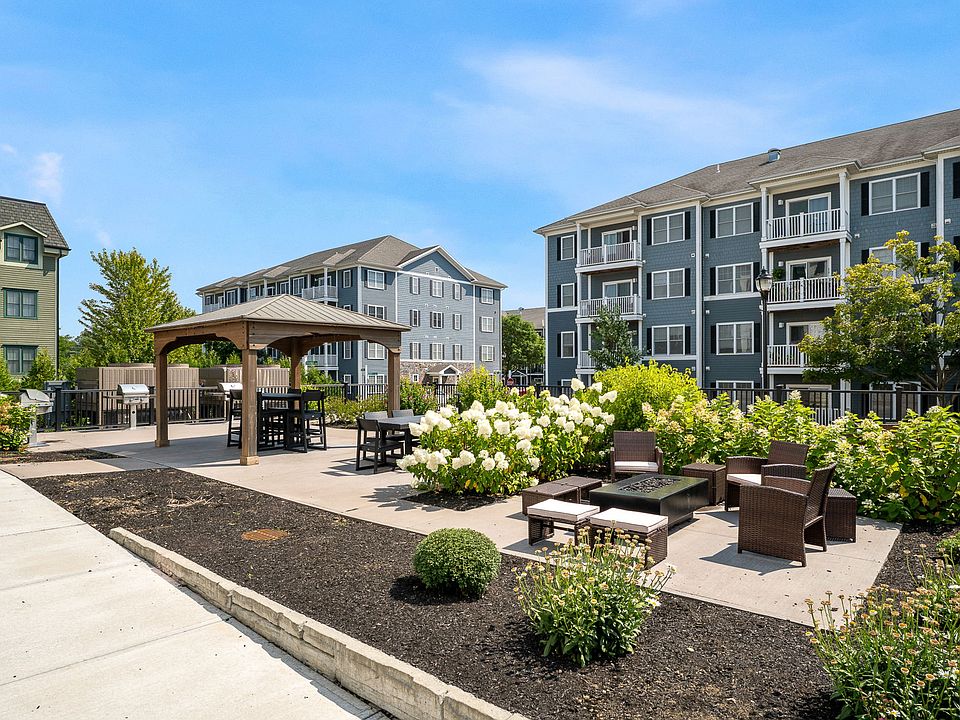 Community Outdoor Space Behind 60 Severance - Firepit, Grills, Shuffleboard for all to enjoy!