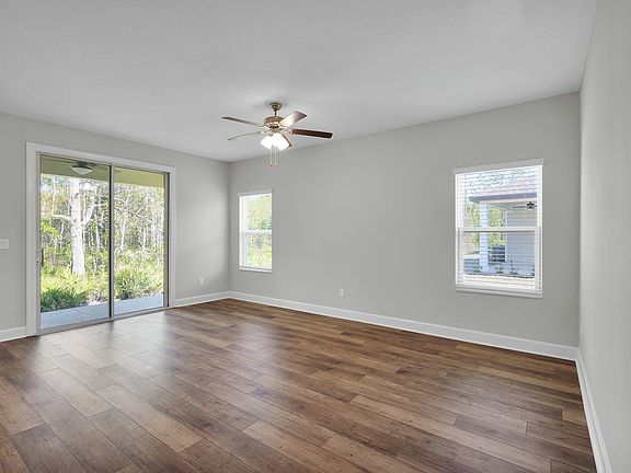 The family room is spacious and has a sliding glass door to the back yard