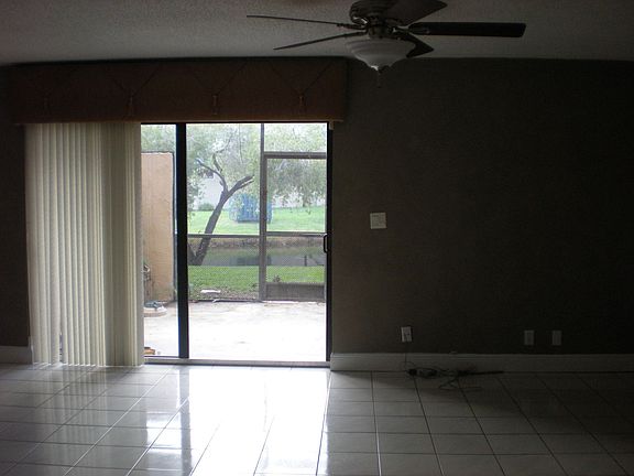 Living room view of screened patio & lake
