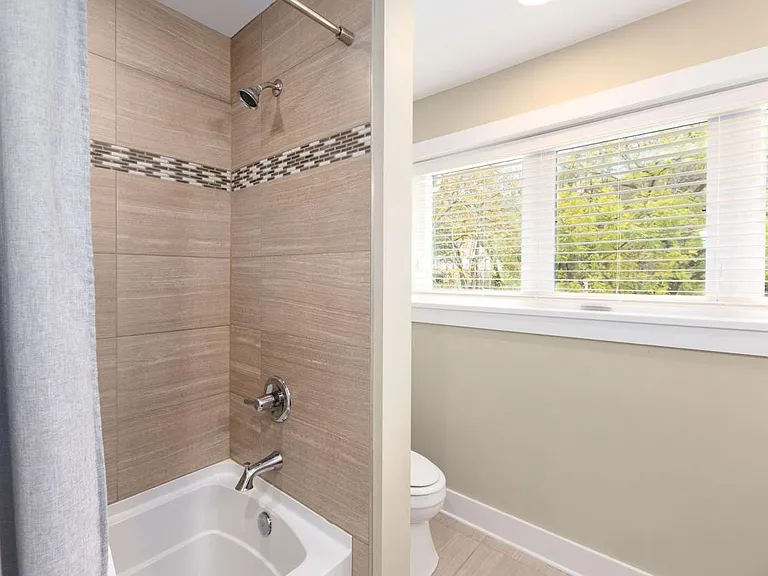 Second Level Bathroom with Oversize Tub and Tile Surround