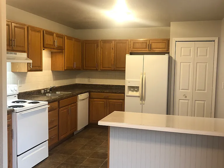 Please note: photos were taken prior to renovation. New luxury vinyl plank flooring, fresh paint throughout, new stainless steel appliances, and a new peninsula countertops are currently being installed.