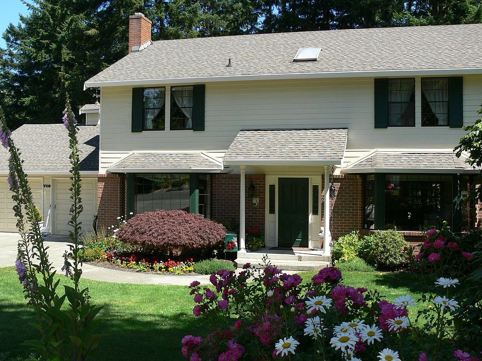 Two story with two bays and lots of brick trim