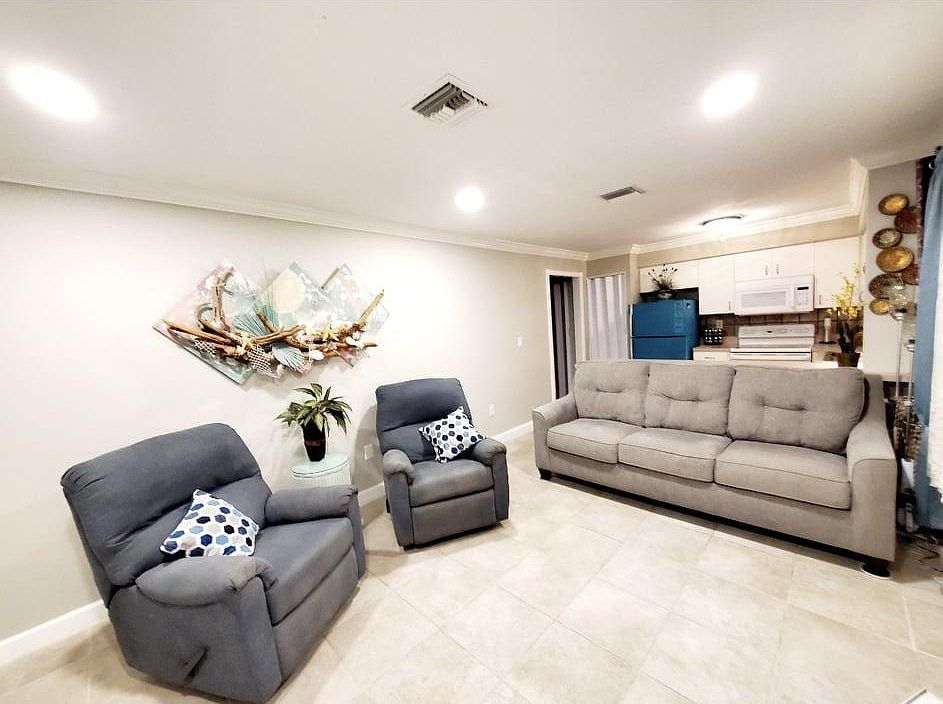 Family Room with two recliner and 60 inch television. Sofa has a pull out bed for visiting guests.