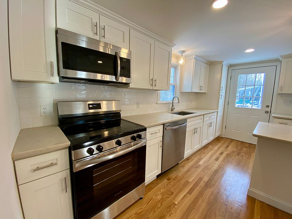 All new stainless steel appliances, new cabinets, tile backsplash. Window above sink overlooks backyard.