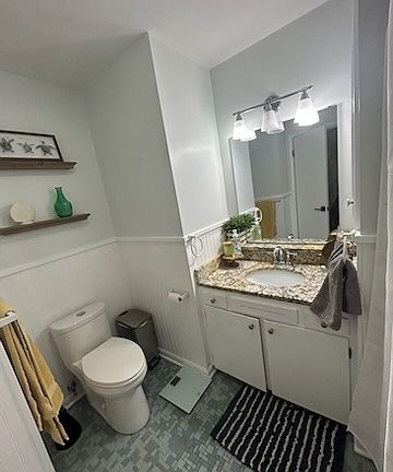 Hallway bathroom with tub and shower.