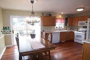 Pergo wood finish floors throughout all of main floor. Doorwall to deck
