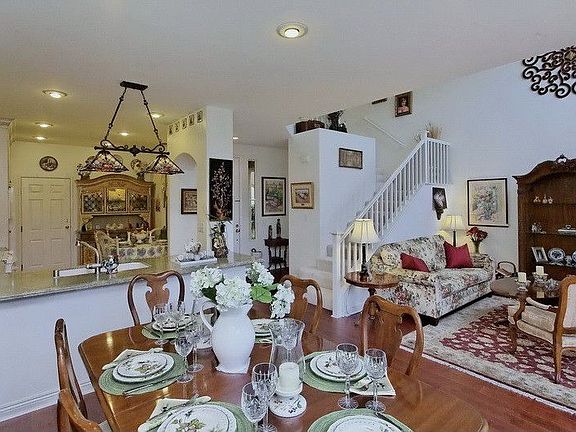 Dining area looking into kitchen and living room.