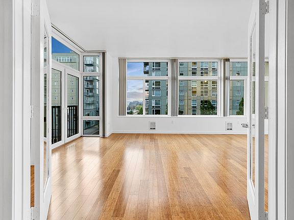 View from bedroom facing with french doors opening up into the living room.