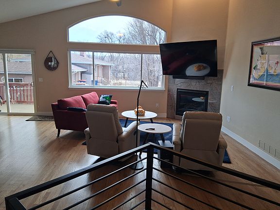 TV area with south-facing windows. Access to deck