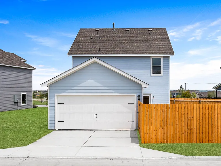 The back yard of the Camelia is fully fenced in and has a patio space.