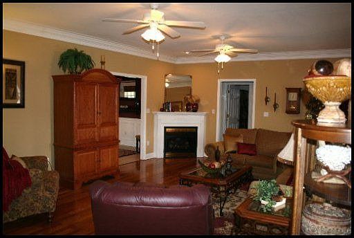 Beautiful Great room with gas fireplace and crown moldings and hardwood floori