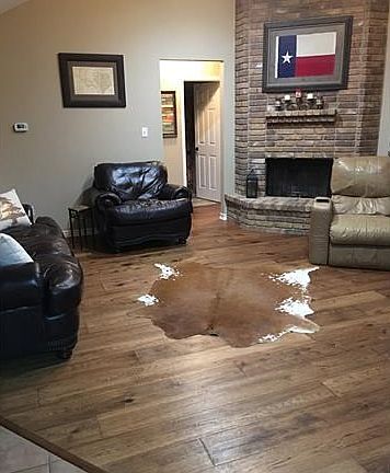 Beautiful new flooring with high ceiling and awesome fireplace.