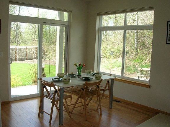 Sunny breakfast nook overlooking colorful garden