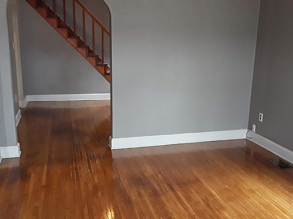 Living room opening to dining room and hall