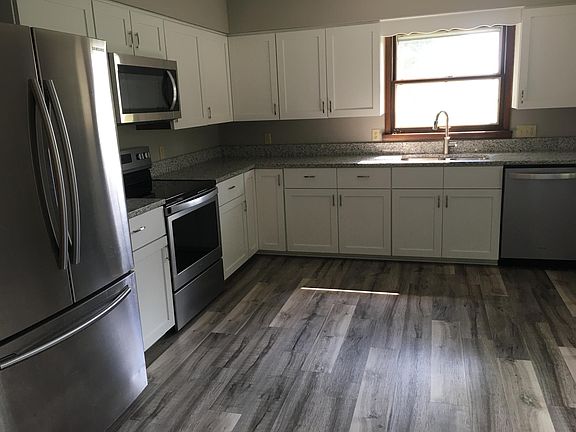 Kitchen details; french door fridge, elec range, over-range microwave, dishwasher, garbage disposal, plenty of cabinets, granite countertop.