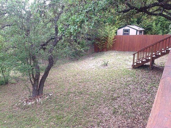 ANOTHER VIEW OF BACKYARD WITH STAIRS FROM DECK
