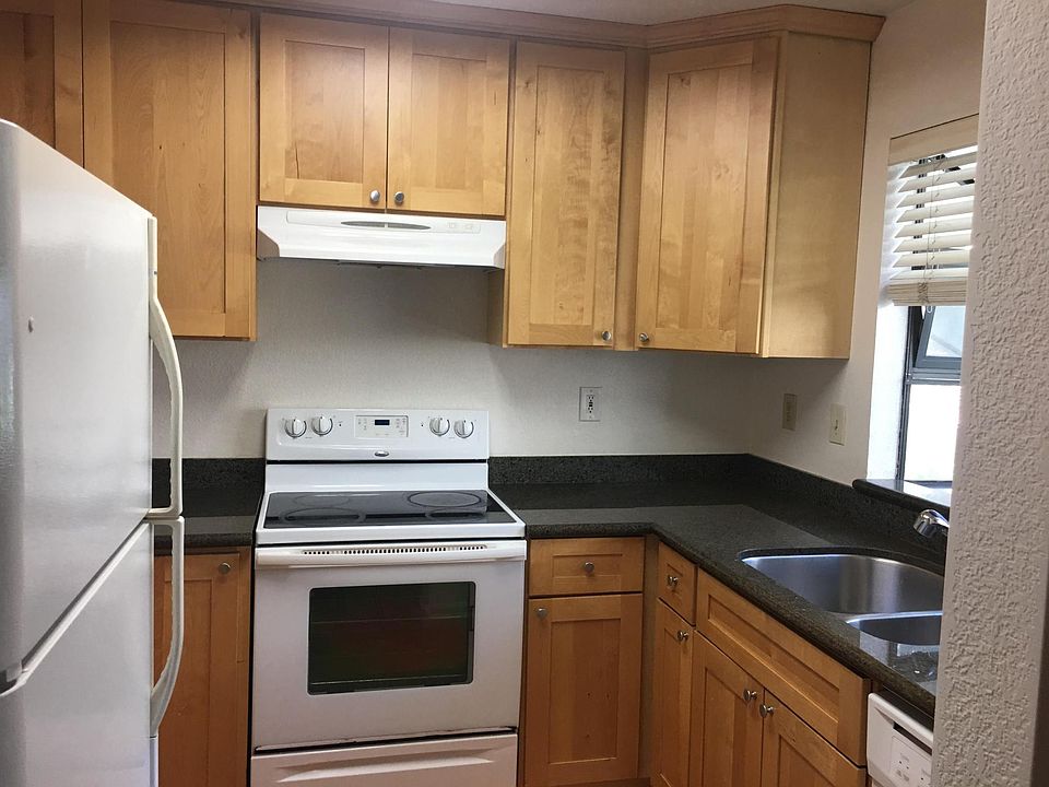 Kitchen Equipped with Refrigerator, Oven, and Dishwasher