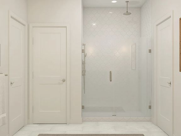 Primary bath with glass shower enclosure