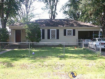Front of the house. Entire yard is fenced, front and back.